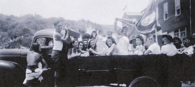 A group of people in a wagon

Description automatically generated